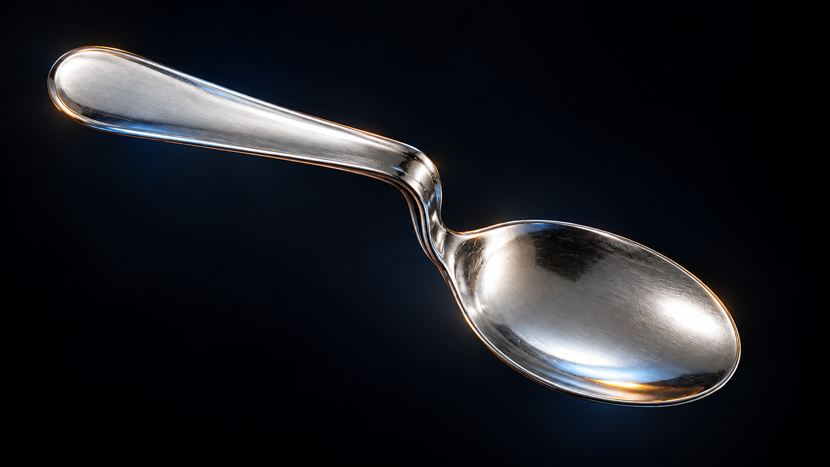 Bent silver spoon against a dark background