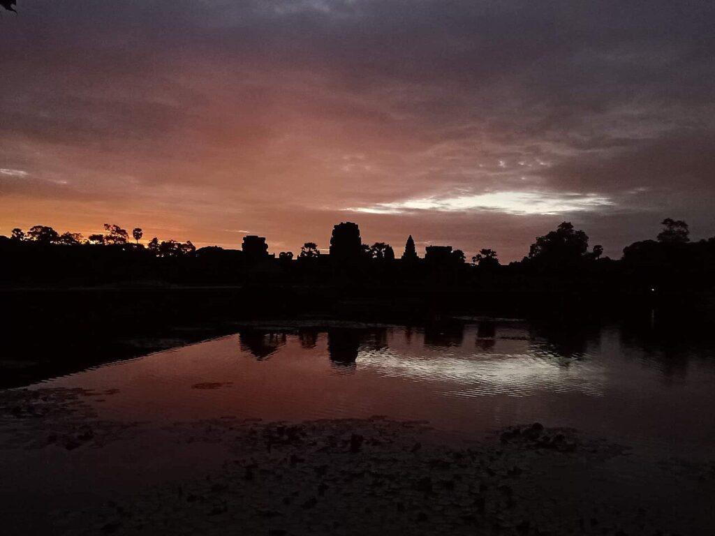 Angkor Wat reflected in water at dawn, Siem Reap, Cambodia